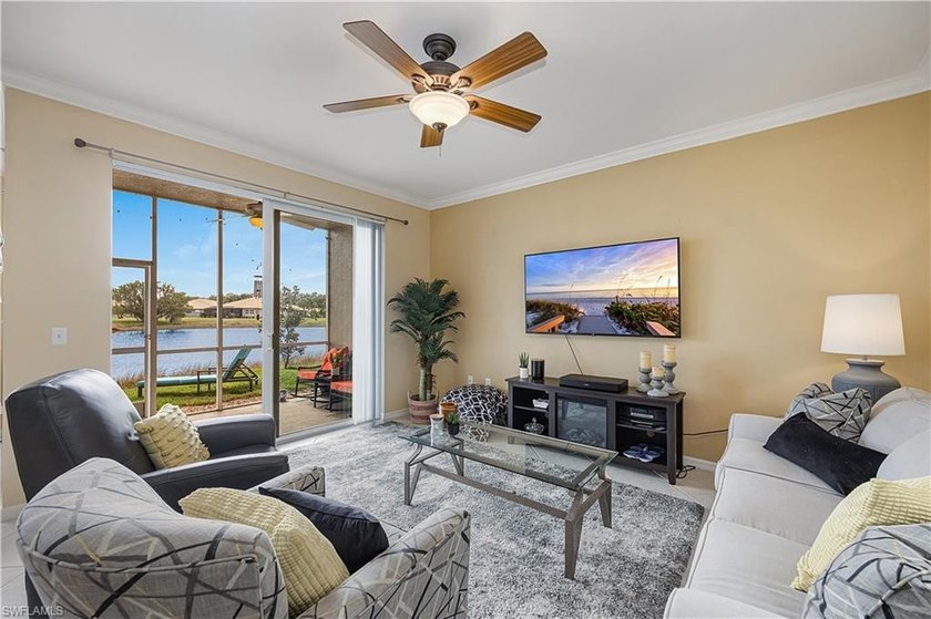 Wake up to sparkling lake views and warm Florida sunshine in - Beach Condo for sale in Estero, Florida on Beachhouse.com