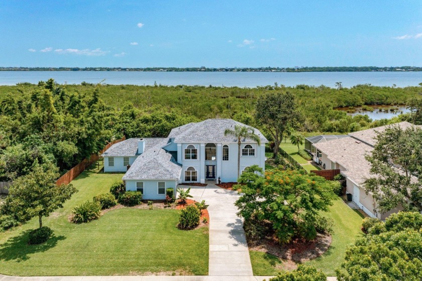 Experience the epitome of luxury waterfront living in this - Beach Home for sale in Merritt Island, Florida on Beachhouse.com