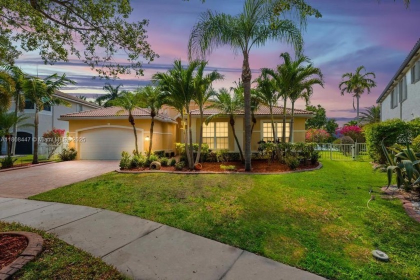 Nestled on a spacious lot along the largest lake in Sunset Lakes - Beach Home for sale in Miramar, Florida on Beachhouse.com