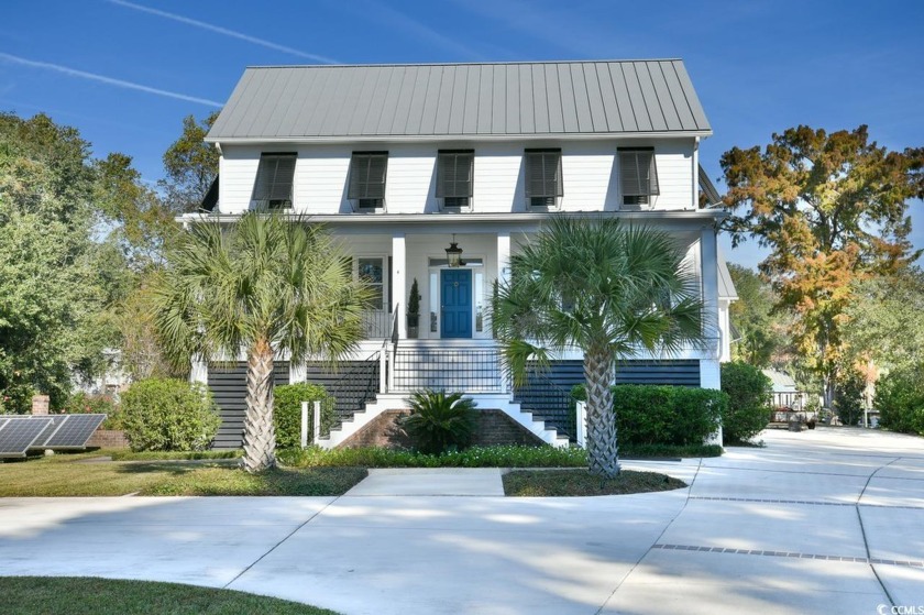 Exceptional low country raised farm house on a canal in the much - Beach Home for sale in Pawleys Island, South Carolina on Beachhouse.com