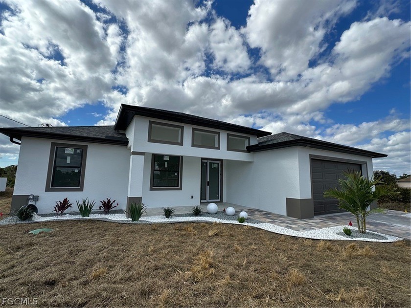 NEW CONSTRUCTION! Modern 4BR/2BA home situated on an oversized 0 - Beach Home for sale in Lehigh Acres, Florida on Beachhouse.com