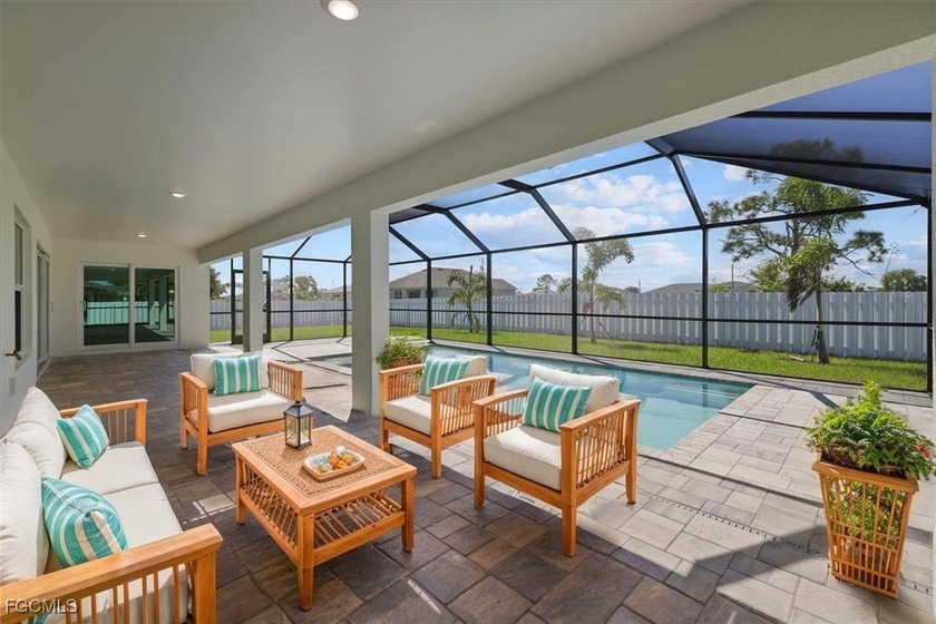TRIPLE LOT! SPACIOUS SCREENED-IN POOL HOME WITH A PRIVACY FENCE - Beach Home for sale in Cape Coral, Florida on Beachhouse.com
