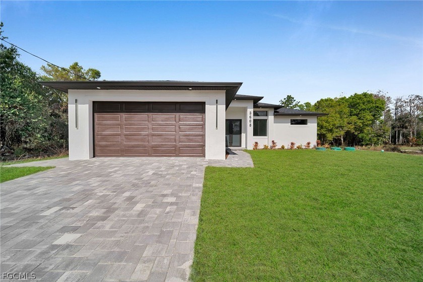 Brand-new construction offering 1,507 sq ft under air with a - Beach Home for sale in Lehigh Acres, Florida on Beachhouse.com