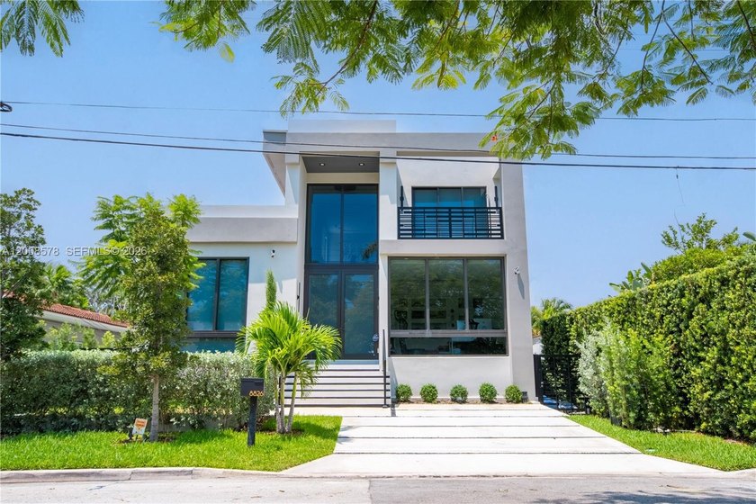 Step into your dream oasis--a masterpiece of modern luxury and - Beach Home for sale in Surfside, Florida on Beachhouse.com