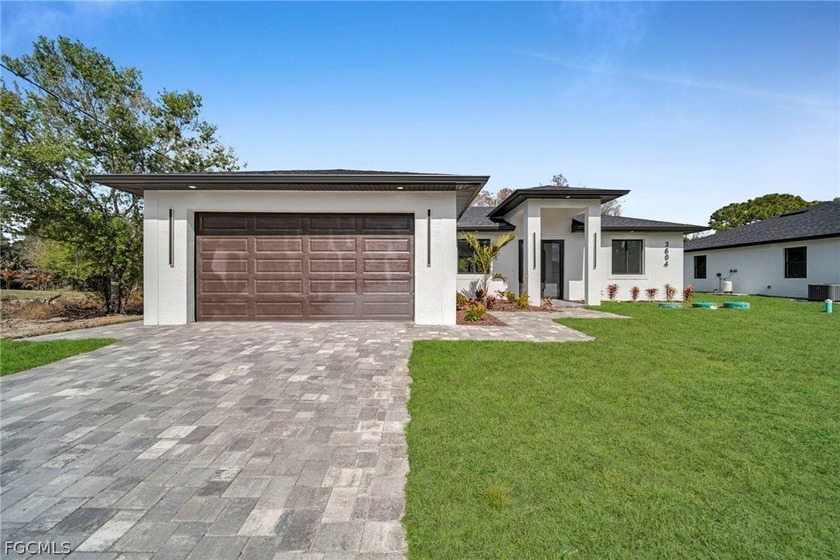 Brand-new construction offering 1,387 sq ft under air with a - Beach Home for sale in Lehigh Acres, Florida on Beachhouse.com