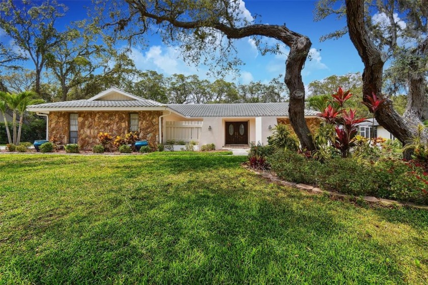 Welcome to 2840 Pheasant Run - a STUNNING POOL HOME nestled on - Beach Home for sale in Clearwater, Florida on Beachhouse.com