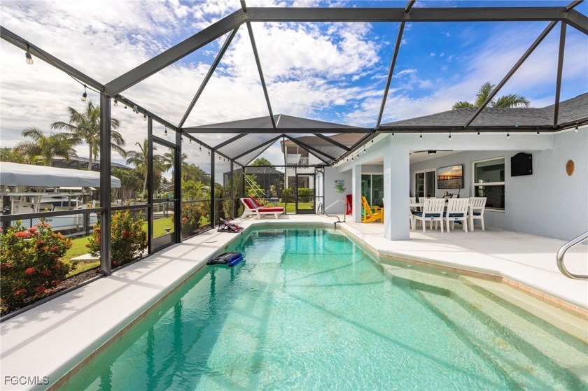 This impressive, move-in ready Gulf-access home is tucked within - Beach Home for sale in Cape Coral, Florida on Beachhouse.com