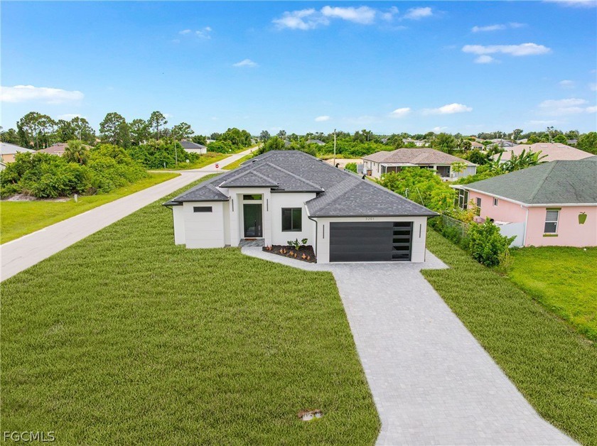 Welcome to this striking new construction home in Lehigh Acres - Beach Home for sale in Lehigh Acres, Florida on Beachhouse.com