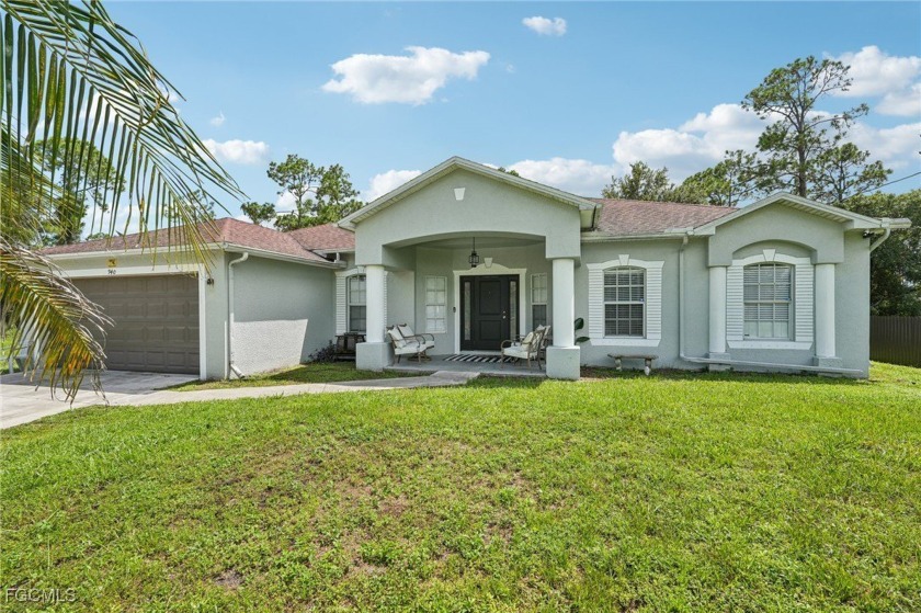 This charming traditional ranch home offers the perfect blend of - Beach Home for sale in Lehigh Acres, Florida on Beachhouse.com