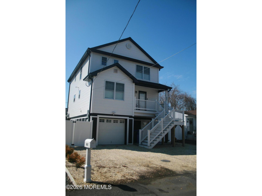 An elevated, two-year-young Custom Colonial offering scenic - Beach Home for sale in Brick, New Jersey on Beachhouse.com