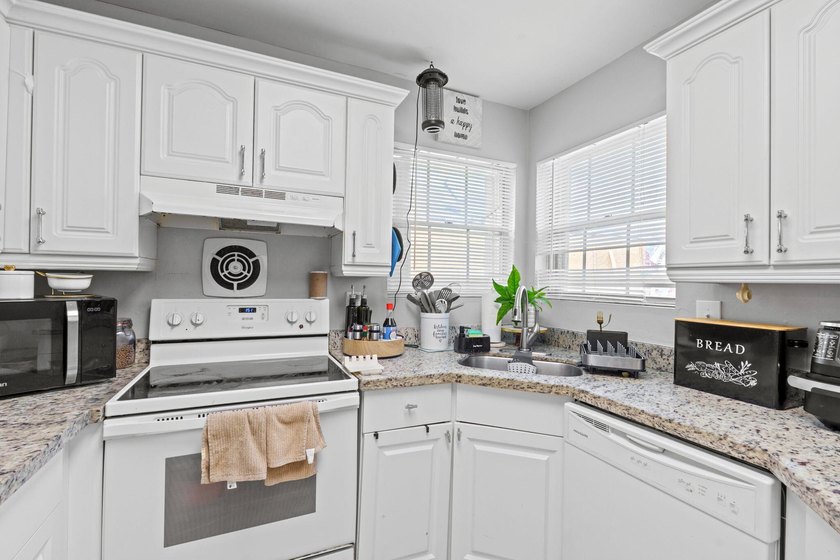 Welcome to this charming 3-bedroom, 2-bathroom home with a 2-car - Beach Home for sale in West Palm Beach, Florida on Beachhouse.com