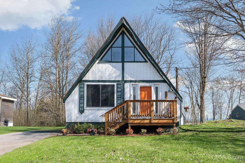 Nestled on a large lot at one of the highest points in the city - Beach Home for sale in Marquette, Michigan on Beachhouse.com
