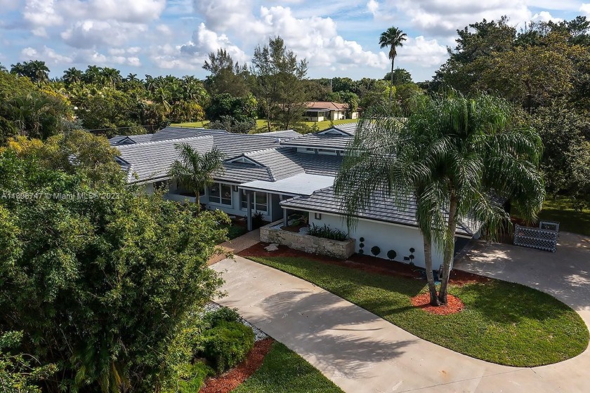 Custom-built waterfront estate w/ pool & tennis court that sits - Beach Home for sale in Coral  Springs, Florida on Beachhouse.com