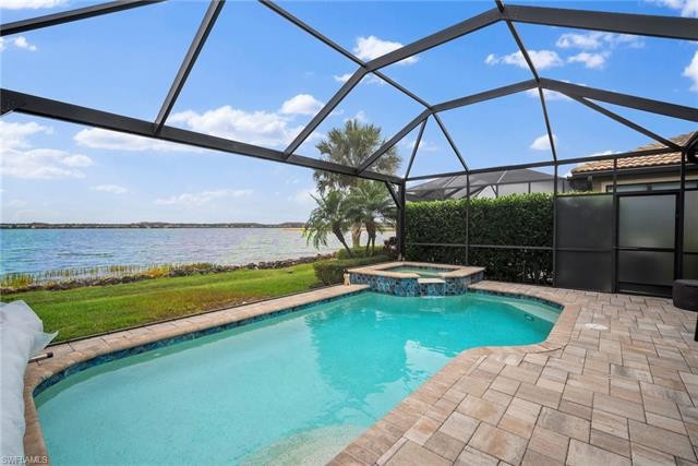 MOTIVATED SELLER! POOL AND SPA HOME ON THE LAKE, OFFERED TURNKEY - Beach Home for sale in Estero, Florida on Beachhouse.com