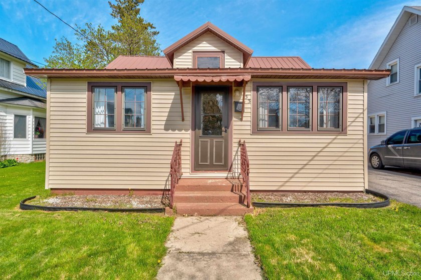 Welcome home to this adorable, 1-story ranch-style property that - Beach Home for sale in Manistique, Michigan on Beachhouse.com