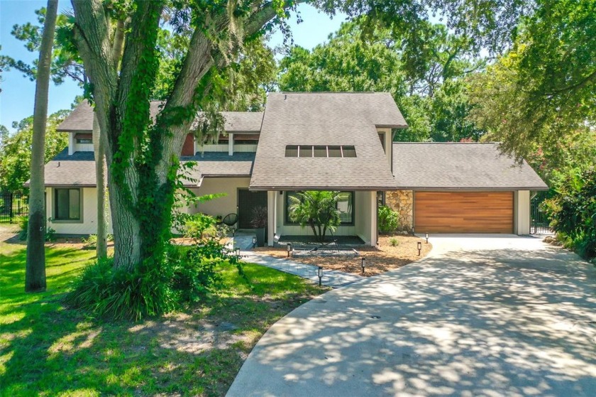 Discover the epitome of mid-century modern design, now - Beach Home for sale in Palm Coast, Florida on Beachhouse.com