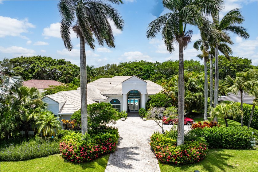 Set on over a private half an acre in one of Palm Beach Gardens' - Beach Home for sale in Palm Beach Gardens, Florida on Beachhouse.com