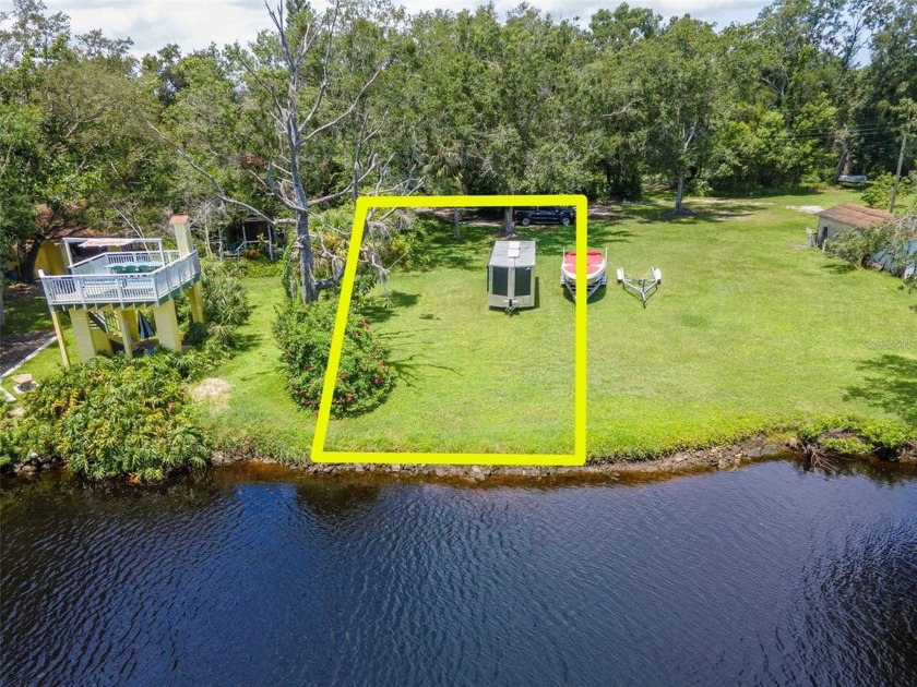 Discover your private haven on this rare .20 Acre WATERFRONT - Beach Lot for sale in Holiday, Florida on Beachhouse.com