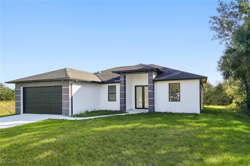 Stunning 3 bedroom + den, 2 bath home featuring modern and - Beach Home for sale in Lehigh Acres, Florida on Beachhouse.com