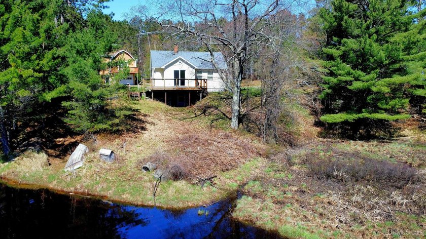 Year-round living on the Sand River with Lake Superior public - Beach Home for sale in Marquette, Michigan on Beachhouse.com