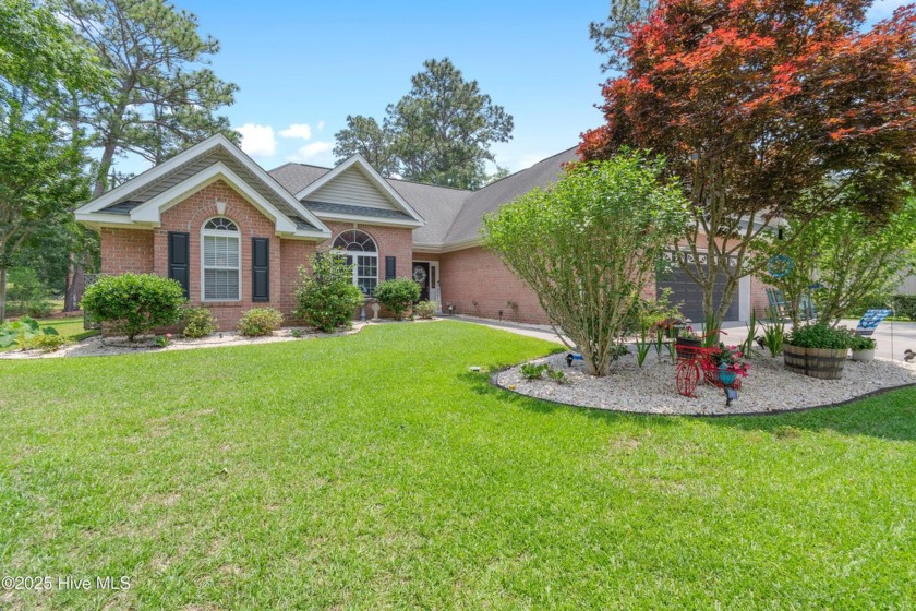 Discover this stunning brick home on just under half an acre - Beach Home for sale in Calabash, North Carolina on Beachhouse.com