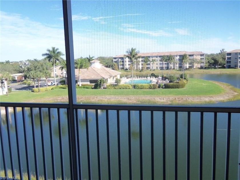 Spectacular view of the beautiful lake fountains and clubhouse - Beach Condo for sale in Estero, Florida on Beachhouse.com