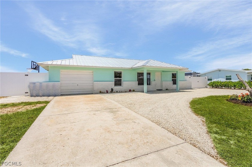 This meticulously upgraded home has undergone a remarkable - Beach Home for sale in Cape Coral, Florida on Beachhouse.com