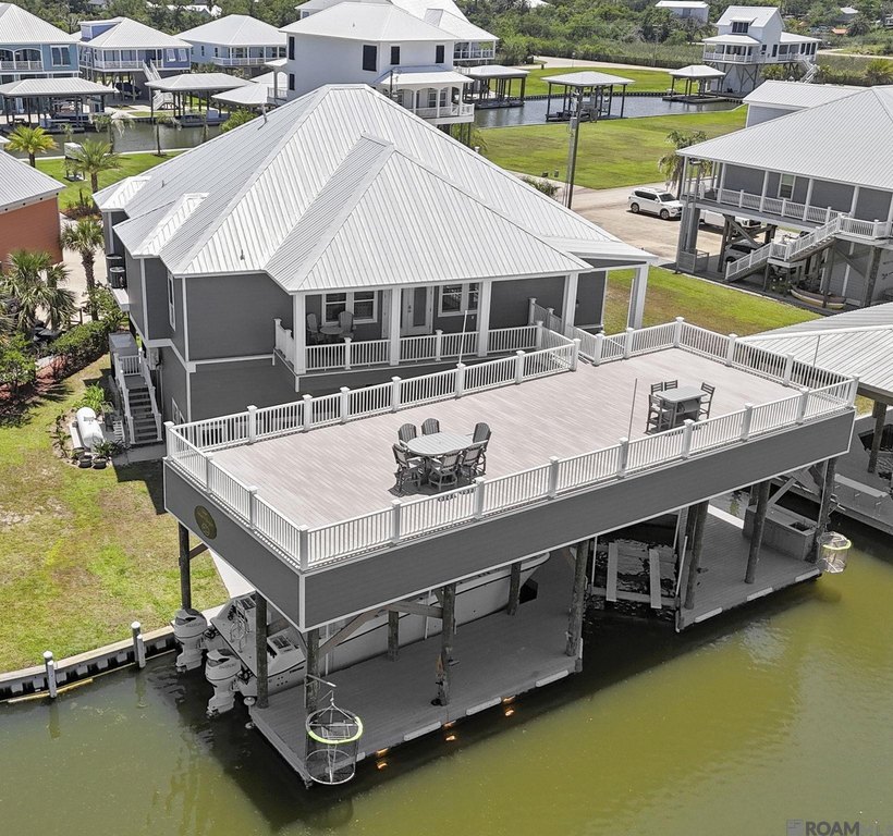 This 4 year old custom built coastal property in the private - Beach Home for sale in Grand Isle, Louisiana on Beachhouse.com
