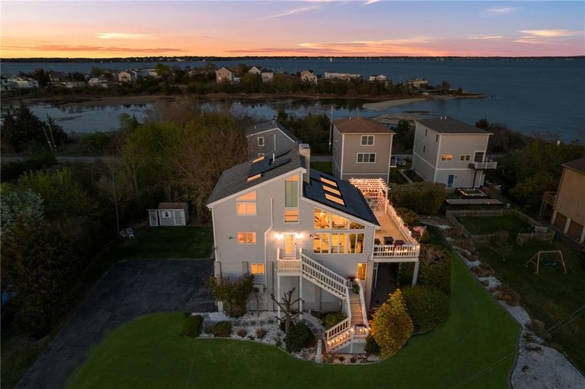 Set against sweeping saltwater views of Conimicut Point with - Beach Home for sale in Warwick, Rhode Island on Beachhouse.com