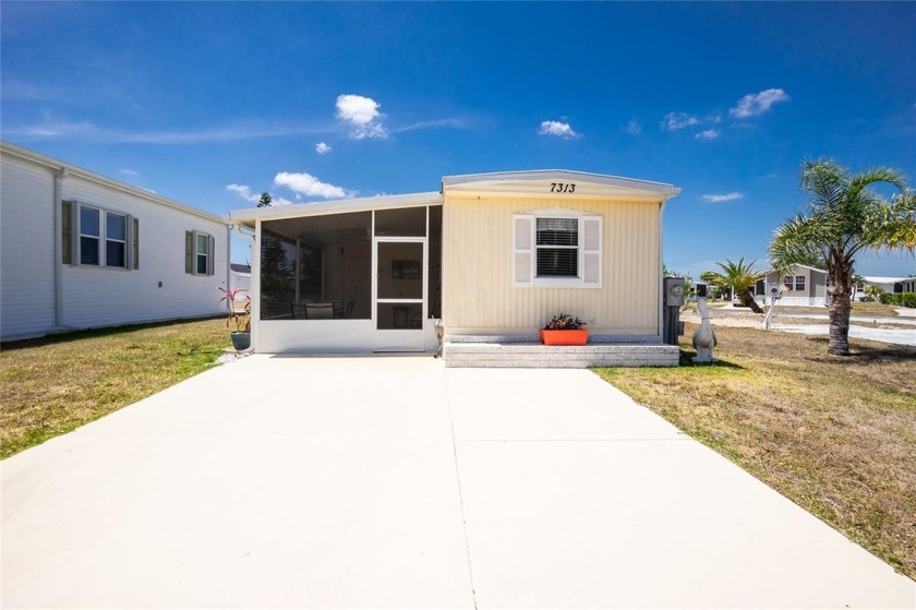 Welcome to the Village of Holiday Lake, a vibrant vacation-style - Beach Home for sale in Port Charlotte, Florida on Beachhouse.com