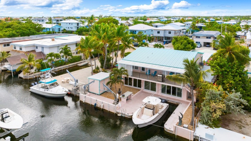 YOUR PERFECT SUMMER RETREAT! Spacious double lot canal front - Beach Home for sale in Key Largo, Florida on Beachhouse.com