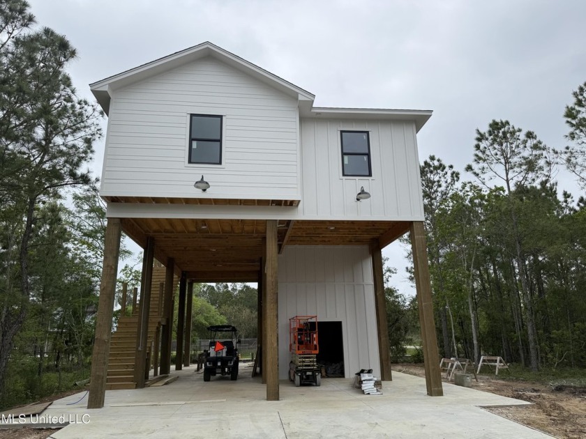 Welcome to this stunning new construction waterfront home! This - Beach Home for sale in Bay Saint Louis, Mississippi on Beachhouse.com