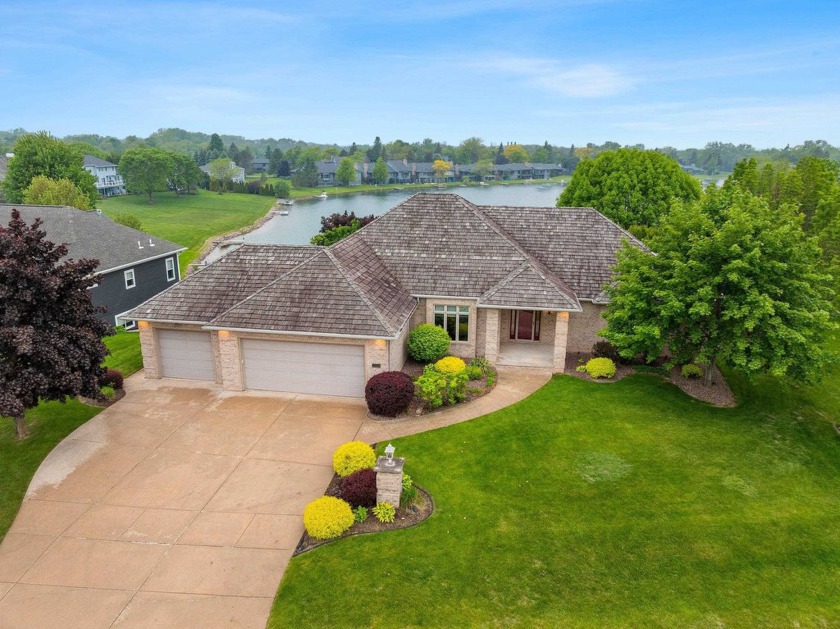 Watch the sunset from your living room! This exceptional - Beach Home for sale in Green Bay, Wisconsin on Beachhouse.com