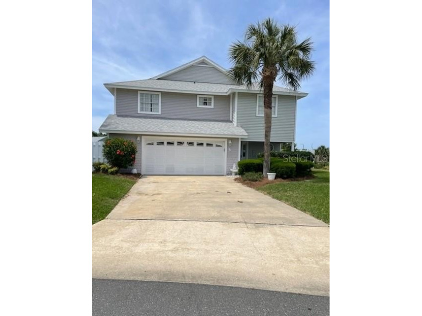 This custom built beauty is situated in an oceanfront Gated - Beach Home for sale in Palm Coast, Florida on Beachhouse.com