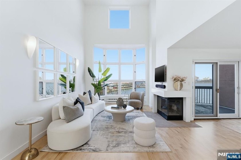 Elevated waterfront living with iconic NYC skyline and Hudson - Beach Home for sale in Edgewater, New Jersey on Beachhouse.com