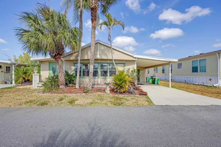 This charming 2-bedroom, 2-bathroom home is situated on a - Beach Home for sale in Port Charlotte, Florida on Beachhouse.com