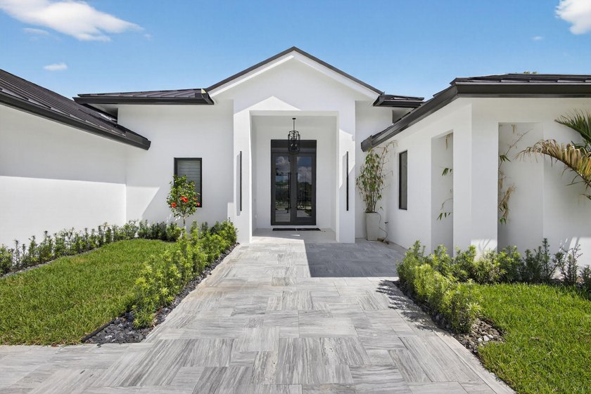 Completely reimagined, this custom-designed, newly rebuilt - Beach Home for sale in Palm Beach Gardens, Florida on Beachhouse.com