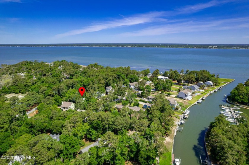 This charming 3-bedroom, 2-bath home is nestled in the desirable - Beach Home for sale in Pine Knoll Shores, North Carolina on Beachhouse.com