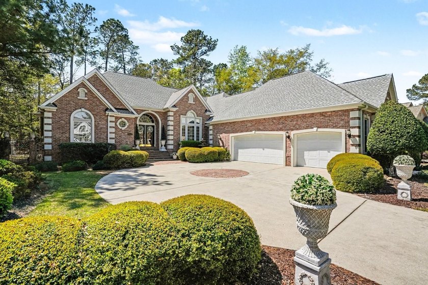 This exceptional 3-bedroom, 3.5-bath all-brick custom home is - Beach Home for sale in Murrells Inlet, South Carolina on Beachhouse.com