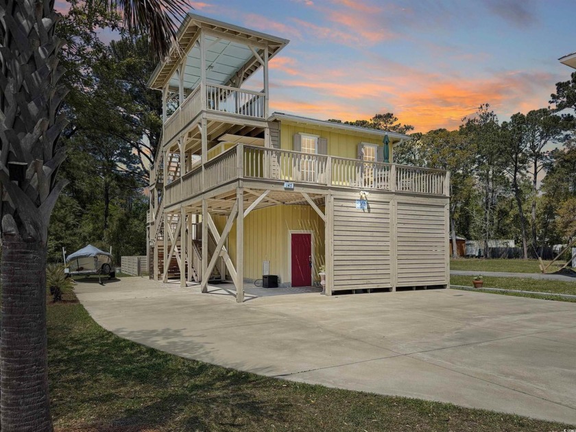 Perched on a spacious lot with sweeping views of the inlet and - Beach Home for sale in Pawleys Island, South Carolina on Beachhouse.com