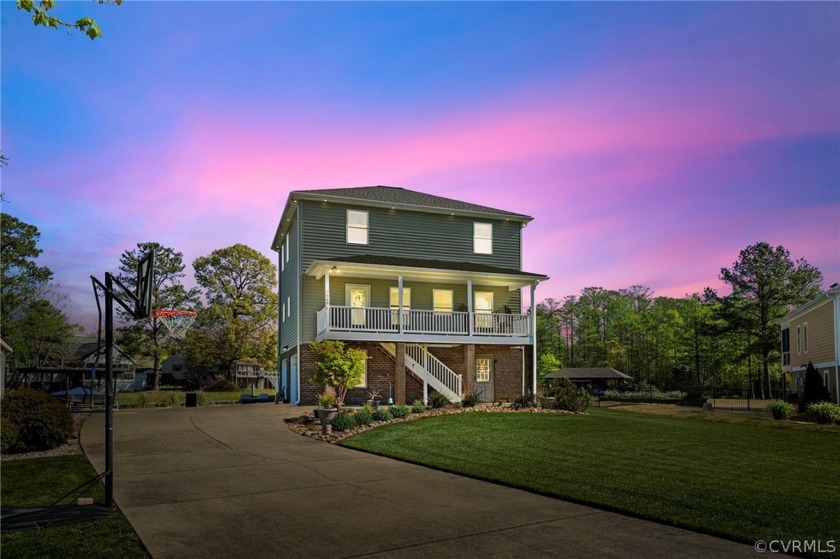 Discover waterfront bliss at 7268 Osprey Drive, a highly - Beach Home for sale in Toano, Virginia on Beachhouse.com