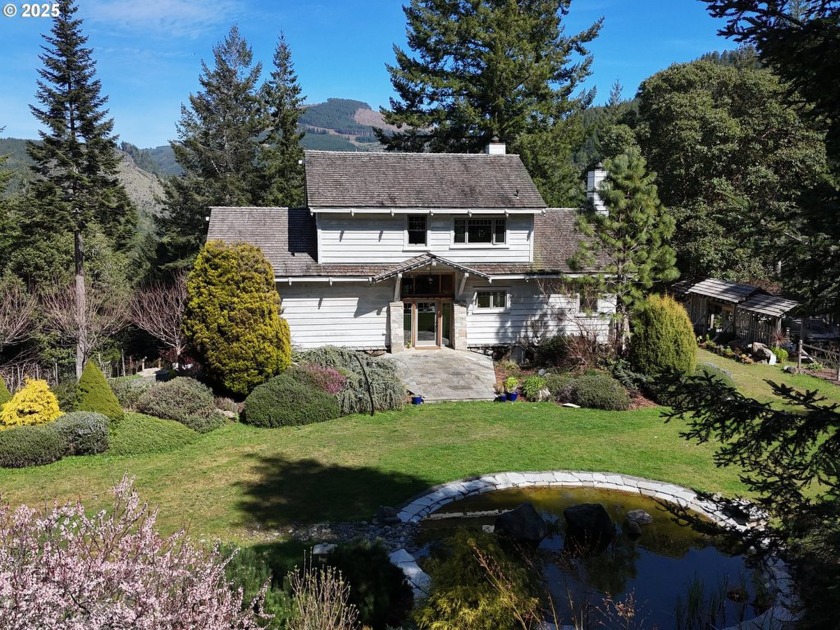 Perched on 42 pristine acres overlooking the Rogue River, this - Beach Home for sale in Gold Beach, Oregon on Beachhouse.com