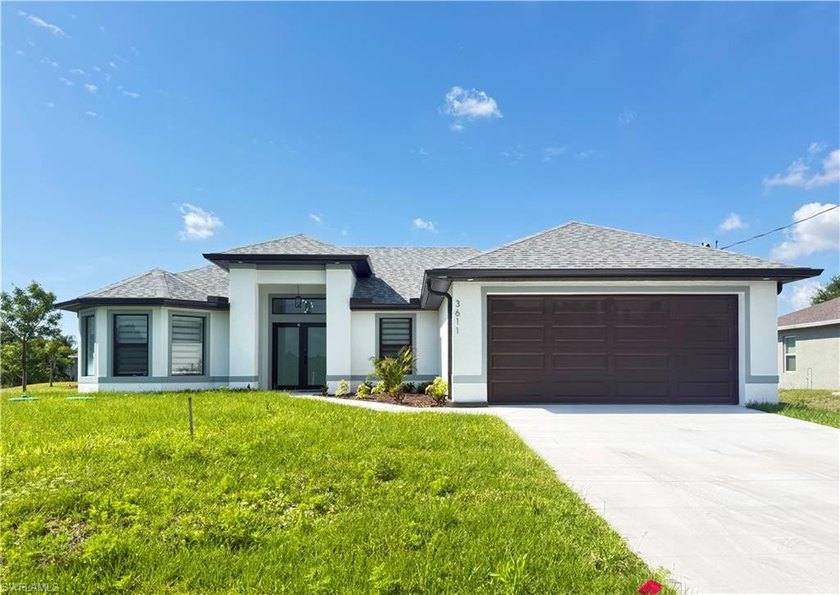 This stunning new construction home offers 1,563 square feet of - Beach Home for sale in Lehigh Acres, Florida on Beachhouse.com