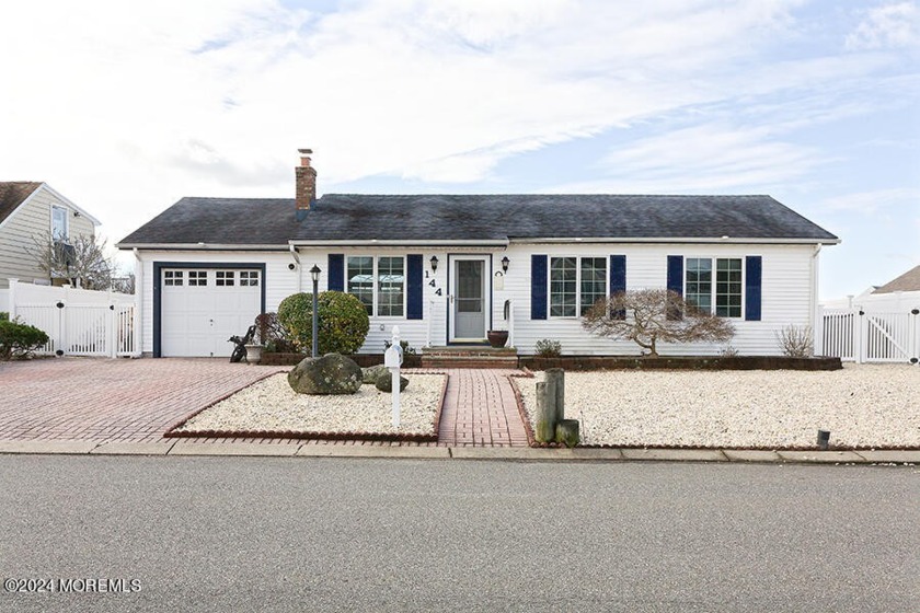 Pretty as a picture in the Coves.  The exterior has so much curb - Beach Home for sale in Manahawkin, New Jersey on Beachhouse.com