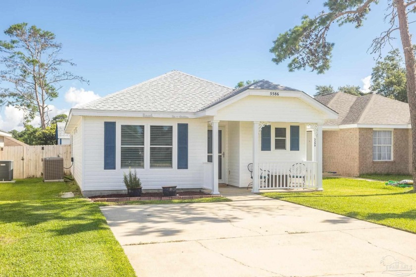 This adorable cottage home is located in the heart of Gulf - Beach Home for sale in Gulf Breeze, Florida on Beachhouse.com