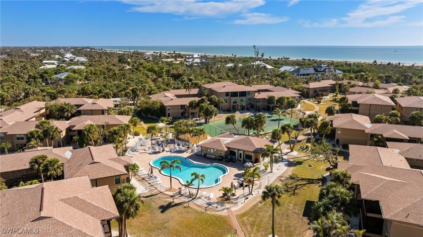Enjoy views of the lovely resort pool from two screened lanais - Beach Condo for sale in Sanibel, Florida on Beachhouse.com