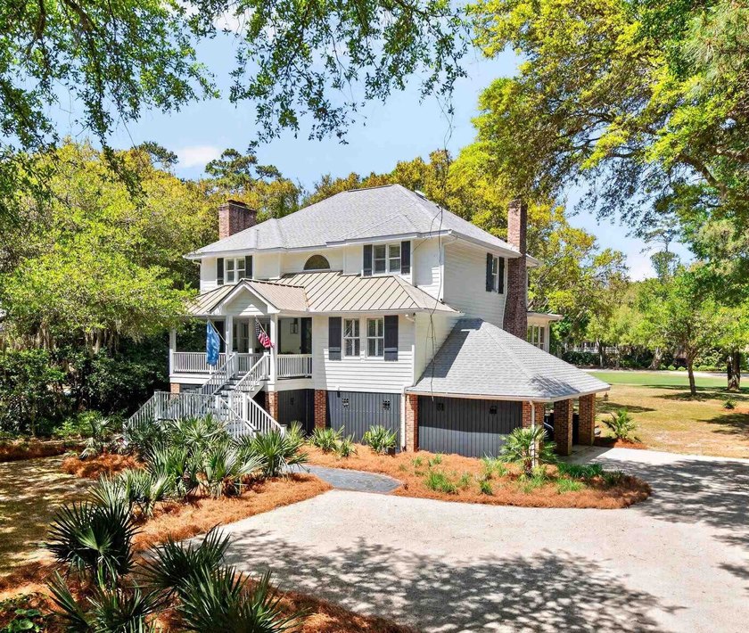 Set on a beautiful lot framed by mature live oaks with panoramic - Beach Home for sale in Georgetown, South Carolina on Beachhouse.com