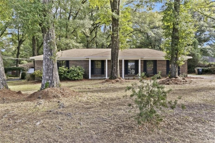 This charming 3-bedroom, 2-bath brick home is situated on large - Beach Home for sale in Mobile, Alabama on Beachhouse.com