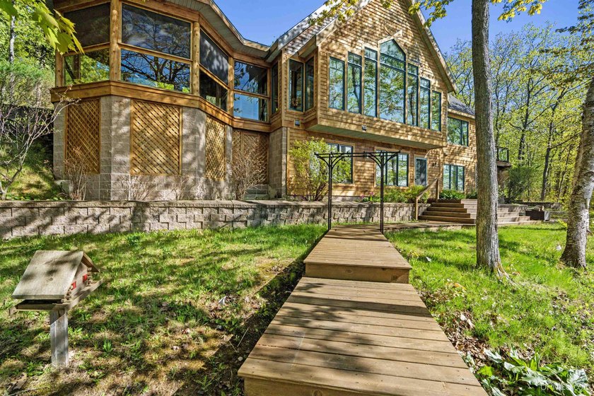 This custom waterfront home offers approximately 150 feet of - Beach Home for sale in Hancock, Michigan on Beachhouse.com