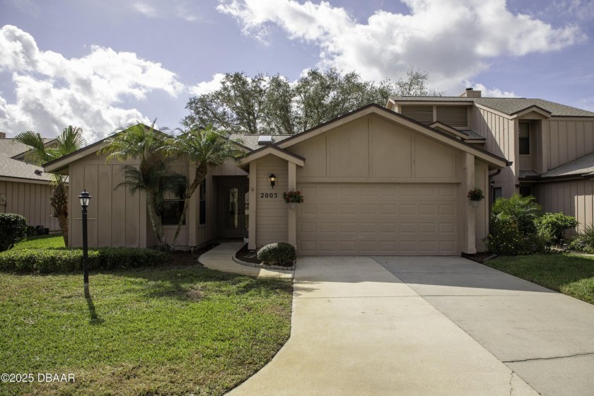 A 2 Bedroom with a Den/2 Bath end unit in the Woodside - Beach Condo for sale in Port Orange, Florida on Beachhouse.com